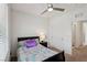 Cozy bedroom with ceiling fan, closet and en-suite bathroom, perfect for restful nights at 2877 Sweeping Palm Rd, North Las Vegas, NV 89086