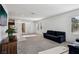 Bright living room features neutral carpet, natural light, and an open concept layout at 2877 Sweeping Palm Rd, North Las Vegas, NV 89086
