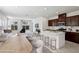 Open floor plan boasts a spacious living area with modern kitchen featuring a center island with seating at 2877 Sweeping Palm Rd, North Las Vegas, NV 89086