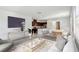 Bright and airy living room features an open floor plan and contemporary furnishings at 2877 Sweeping Palm Rd, North Las Vegas, NV 89086