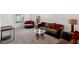 Spacious living room with plush seating, neutral carpet, and bright natural light from the windows at 2877 Sweeping Palm Rd, North Las Vegas, NV 89086
