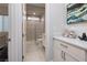 Modern bathroom with a glass-enclosed shower and stylish vanity with marble countertops at 3000 Dusky Willow Ln, Las Vegas, NV 89138