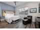 Comfortable secondary bedroom featuring an upholstered headboard and a mountain view at 3000 Dusky Willow Ln, Las Vegas, NV 89138