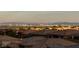 Daytime view of the city skyline over the neighborhood rooftops at 3000 Dusky Willow Ln, Las Vegas, NV 89138