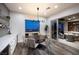 Bright dining area featuring a built-in bar and sliding glass doors to an outdoor living space at 3000 Dusky Willow Ln, Las Vegas, NV 89138