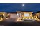 Charming single-story home featuring manicured landscaping and a brick-accented two-car garage under a moonlit sky at 3000 Dusky Willow Ln, Las Vegas, NV 89138