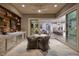 Inviting outdoor space featuring a kitchen, comfortable seating, and seamless indoor/outdoor flow at 3000 Dusky Willow Ln, Las Vegas, NV 89138