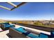 An outdoor lounge area features comfortable seating and scenic views of the surrounding desert landscape at 3000 Dusky Willow Ln, Las Vegas, NV 89138