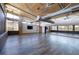 Yoga studio space with wood floors, large windows, ceiling fans, and views of desert landscape at 3000 Dusky Willow Ln, Las Vegas, NV 89138