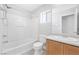 Bright bathroom featuring a shower-tub combo and single vanity with modern fixtures at 3314 Villa Fiori Ave, Las Vegas, NV 89141