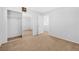 Bright bedroom featuring carpet floors, mirrored closet doors, and a neutral wall color at 3314 Villa Fiori Ave, Las Vegas, NV 89141