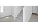 A modern entryway features neutral-colored walls and tile floors plus stairs at 3314 Villa Fiori Ave, Las Vegas, NV 89141