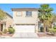 Two-story home featuring a two-car garage, stucco siding, and a red tile roof at 3314 Villa Fiori Ave, Las Vegas, NV 89141