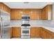 A well-lit kitchen features stainless steel appliances and light countertops at 3314 Villa Fiori Ave, Las Vegas, NV 89141