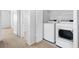 Well-equipped laundry room with modern washer and dryer, providing convenience and efficiency at 3314 Villa Fiori Ave, Las Vegas, NV 89141
