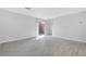 Bright and airy living room boasts tile floors and a sliding glass door at 3314 Villa Fiori Ave, Las Vegas, NV 89141