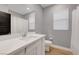 Well-lit bathroom with a large vanity mirror and modern fixtures at 3495 Luca Point Ave, Henderson, NV 89044