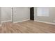 Bedroom showcasing modern doors, wood-look flooring, and clean lines at 3495 Luca Point Ave, Henderson, NV 89044