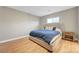 The bedroom features a spacious room with a light color palette and wood-look floors at 3495 Luca Point Ave, Henderson, NV 89044