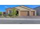 Charming single-story home featuring a three-car garage and well-maintained landscaping in a desirable neighborhood at 3495 Luca Point Ave, Henderson, NV 89044