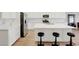 Modern kitchen with stainless steel appliances, quartz countertops, and a spacious island with seating at 3495 Luca Point Ave, Henderson, NV 89044