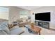 Inviting living room with comfortable seating and a large TV for entertainment at 3495 Luca Point Ave, Henderson, NV 89044