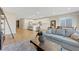 Open-concept living space with a modern kitchen, dining area, and comfortable seating area at 3495 Luca Point Ave, Henderson, NV 89044