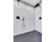This elegant walk-in shower includes a rain shower head and sleek, modern fixtures at 3495 Luca Point Ave, Henderson, NV 89044