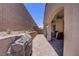 Backyard featuring a covered patio and block wall fencing at 390 Inflection St, Henderson, NV 89011