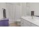 Bathroom features a single sink vanity, with shower-tub combination at 390 Inflection St, Henderson, NV 89011