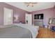 Bedroom with wood floors and large bed and comfortable seating at 390 Inflection St, Henderson, NV 89011