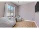 Cozy bedroom featuring a large beanbag and a bright window with sheer curtains at 390 Inflection St, Henderson, NV 89011