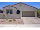 Charming single-story home featuring a two-car garage, desert landscaping, and a private gated courtyard at 390 Inflection St, Henderson, NV 89011