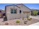 Charming single-story home featuring a two-car garage, desert landscaping, and a private gated courtyard at 390 Inflection St, Henderson, NV 89011