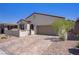 Charming single-story home featuring a two-car garage, desert landscaping, and a private gated courtyard at 390 Inflection St, Henderson, NV 89011