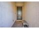 Close-up of the front door featuring a welcome bench and elegant design at 390 Inflection St, Henderson, NV 89011