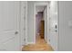 Hallway with wood floors and neutral walls provides access to other rooms at 390 Inflection St, Henderson, NV 89011