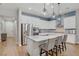 Modern kitchen features stainless steel appliances, granite countertops, and pendant lighting above the breakfast bar at 390 Inflection St, Henderson, NV 89011