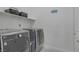 Modern laundry room featuring new front loading washer and dryer at 390 Inflection St, Henderson, NV 89011