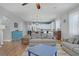 Spacious living room with a colorful rug, wood floors, and view of the kitchen at 390 Inflection St, Henderson, NV 89011