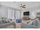 Comfortable living room with plush seating, a ceiling fan, and lots of natural light at 390 Inflection St, Henderson, NV 89011