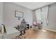 A spacious home office with wood flooring and natural light at 390 Inflection St, Henderson, NV 89011