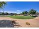 Community park with green lawns, trees, and walking trails, providing a serene environment for residents at 390 Inflection St, Henderson, NV 89011