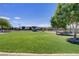 Lush green park with shaded trees, open grassy areas, and walking paths in a peaceful community setting at 390 Inflection St, Henderson, NV 89011