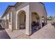 Covered patio area with brick flooring and arched supports at 390 Inflection St, Henderson, NV 89011