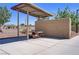 Community picnic area featuring a covered seating area with tables, surrounded by landscaped grounds and trees at 390 Inflection St, Henderson, NV 89011