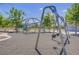 Community playground featuring swings and a net climb structure at 390 Inflection St, Henderson, NV 89011