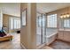 Bright bathroom with tub, enclosed shower, double sink vanity, and shutters at 4134 Riva De Tierra Ln, Las Vegas, NV 89135