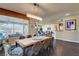 Dining room with a view of the backyard, decorative light fixture, and open to the kitchen at 4134 Riva De Tierra Ln, Las Vegas, NV 89135