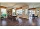 Bright dining area featuring wood floors, elegant lighting, and large windows at 4134 Riva De Tierra Ln, Las Vegas, NV 89135
